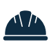 A simple dark blue icon of a construction hard hat, shown from the front on a light background.