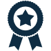 Dark blue icon of an award ribbon with a star in the center and two tails hanging below, symbolizing achievement or recognition.